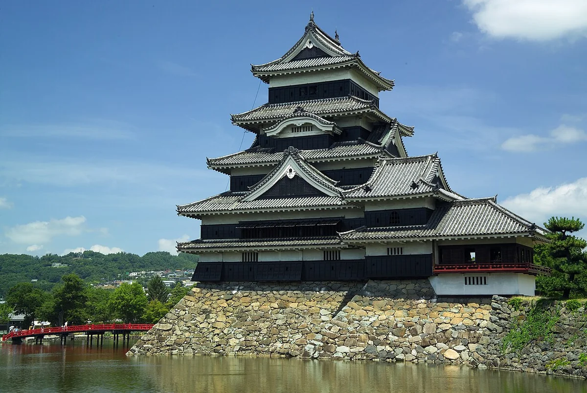 The black keep of Matsumoto Castle seen across its moat