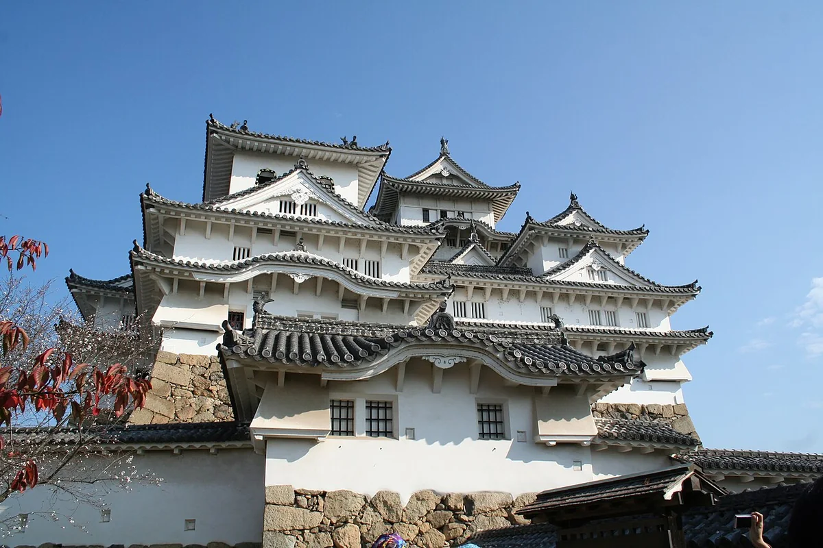 The white keeps of Himeji Castle beneath a blue sky